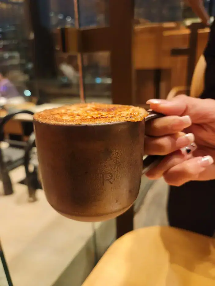 Large coffee mug with R logo for starbucks and a crispy layer of sugar on top