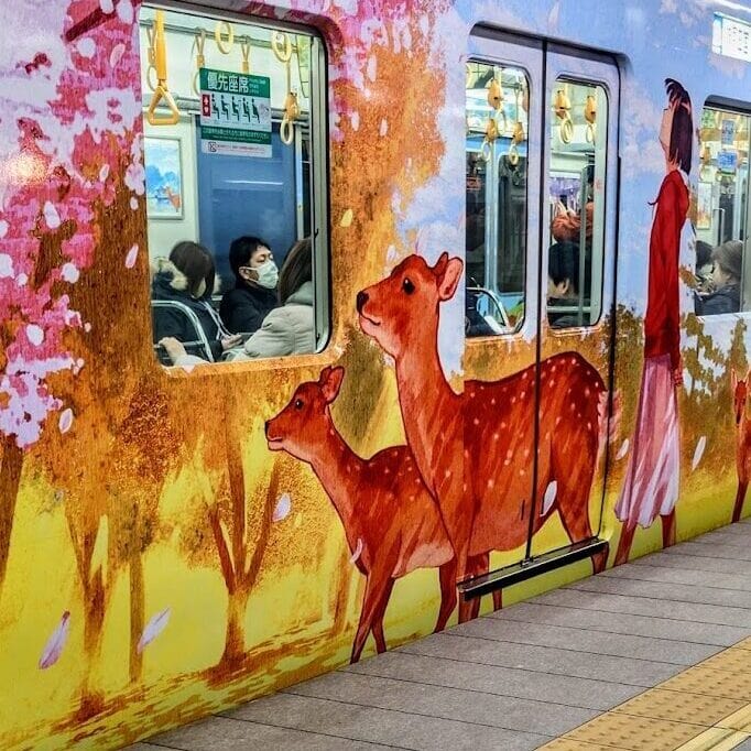 Train in Nara, Japan Station with colorful deer display 