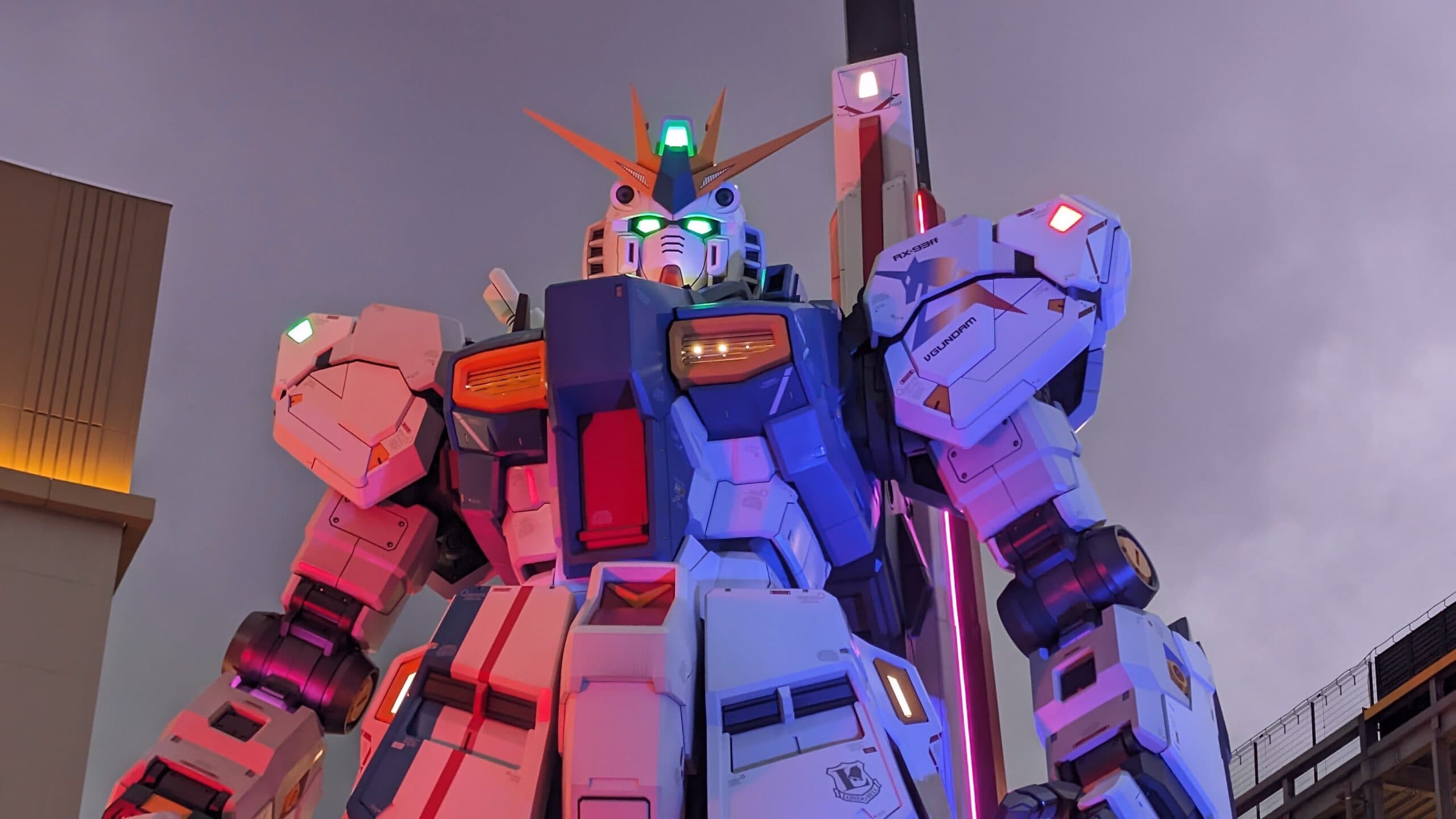 Large Gundam robot statue illuminated at night in Fukuoka, Kyushu, Japan.